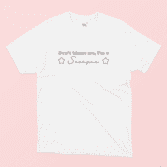 Don't blame me I'm a scorpio illustrated white t-shirt on a pink background