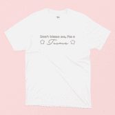 Don't blame me I'm a Taurus illustrated white t-shirt on a pink background