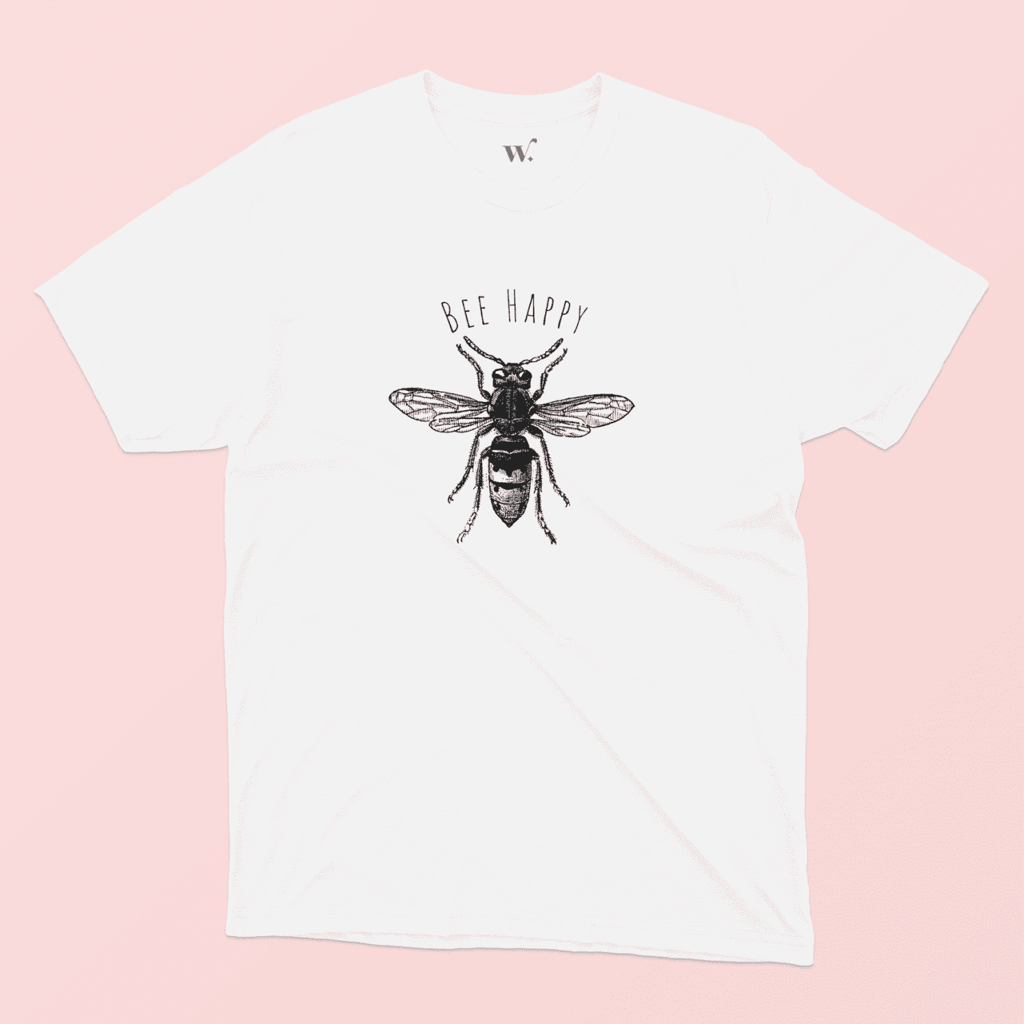 Bee Happy illustrated white t-shirt on a pink background