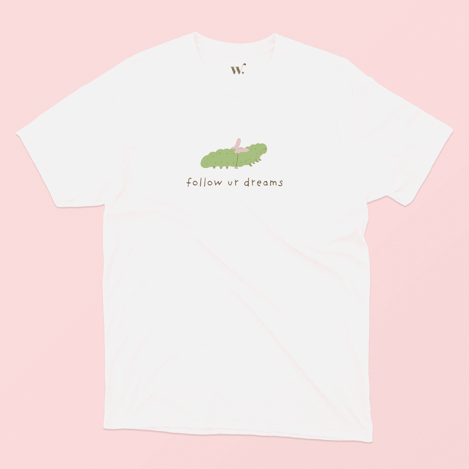 follow ur dreams illustrated white t-shirt on a pink background
