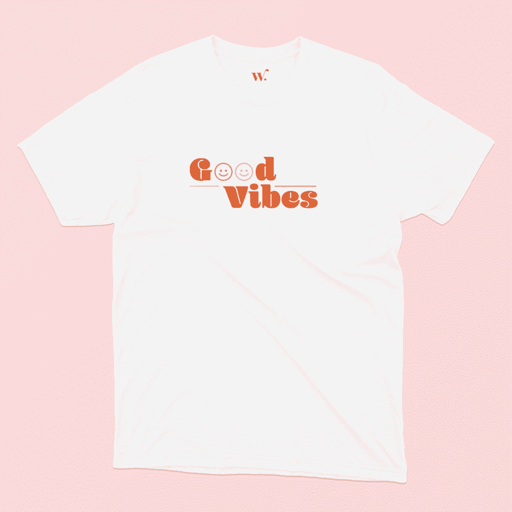 Good Vibes illustrated White T-shirt on a Pink background