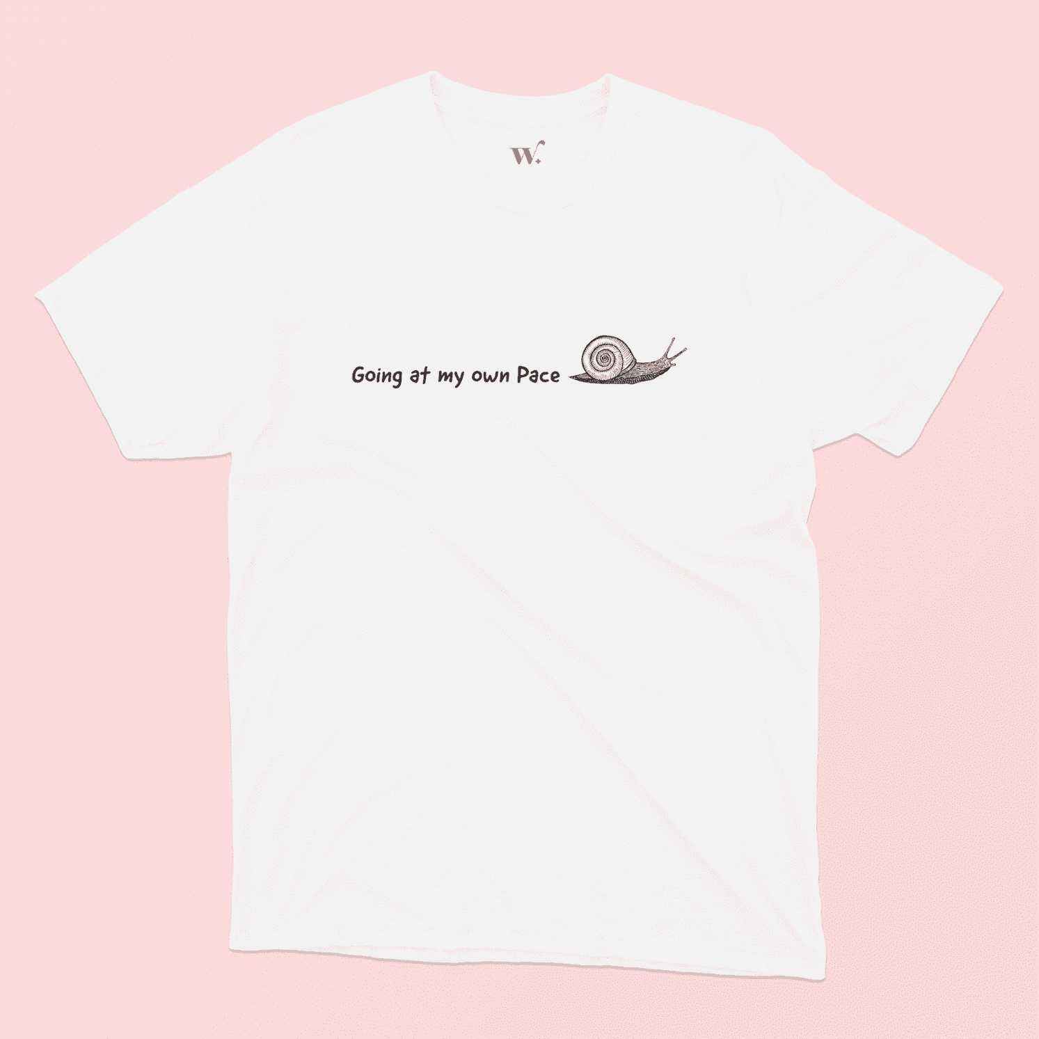 going at my own pace illustrated white t-shirt on a pink background