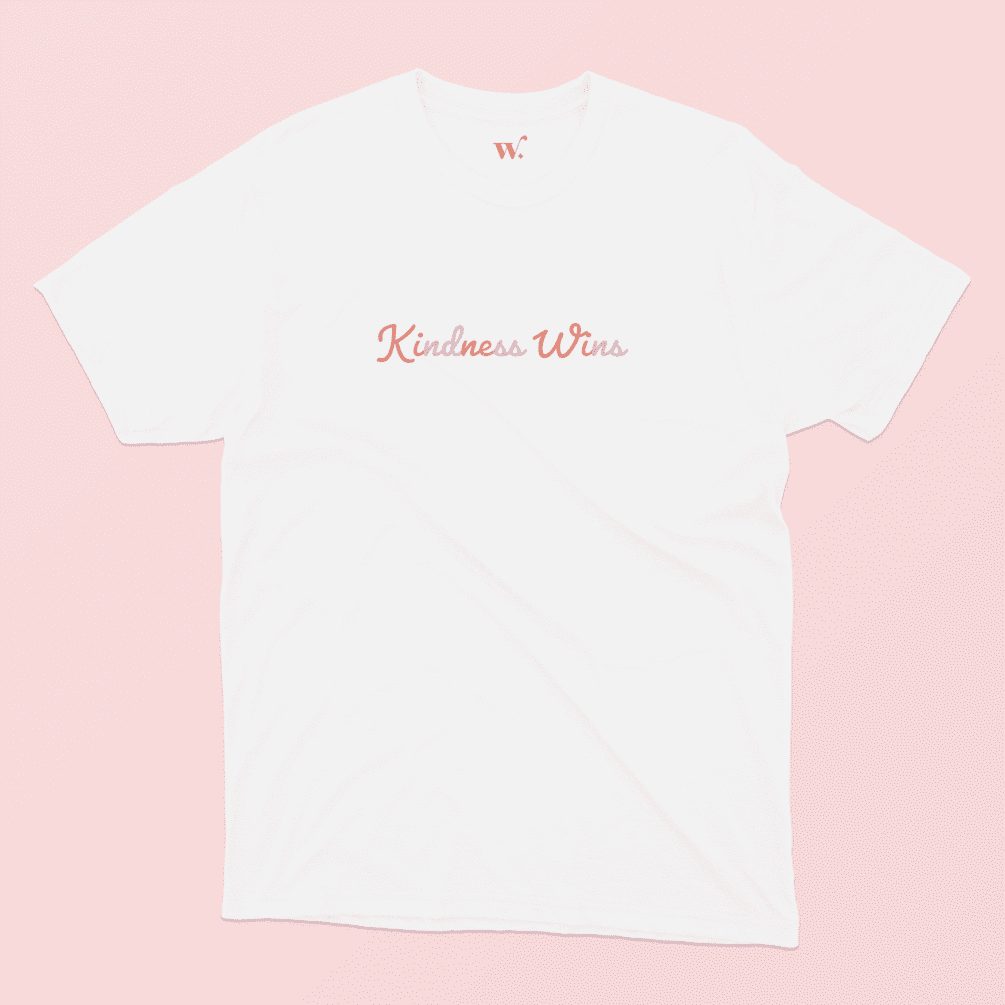 Kindness Wins T-Shirt in White on a Pink background