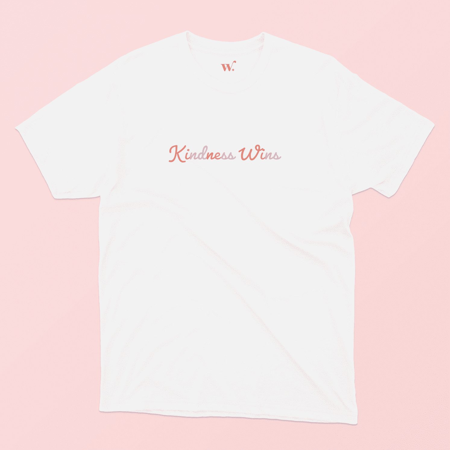 Kindness Wins T-Shirt in White on a Pink background