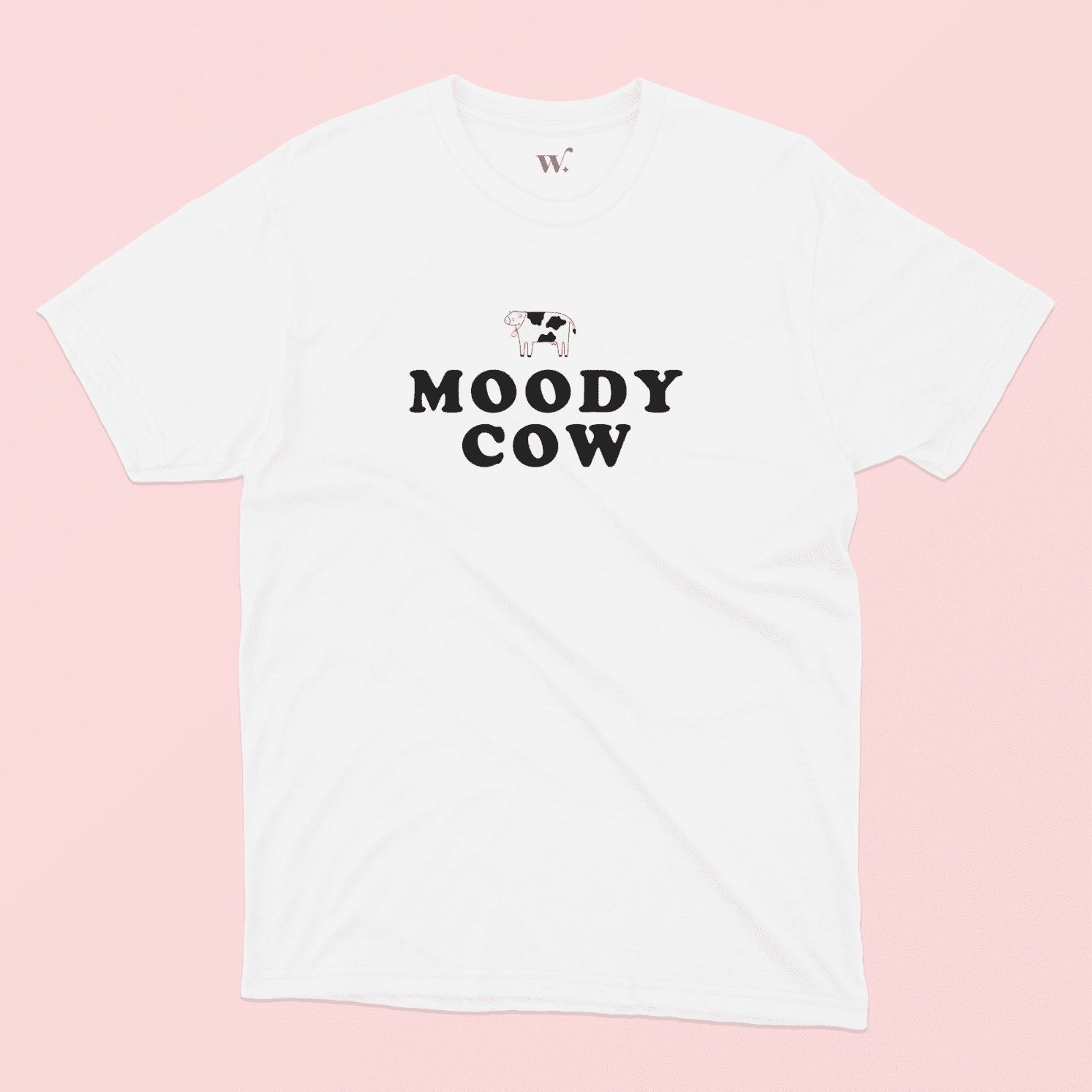 Moody Cow T-shirt Illustrated in White on a Pink background
